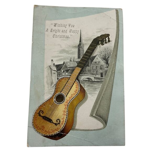 Antique Embossed Christmas Greeting Guitar and Village Scene Bright and Happy - Picture 1 of 4